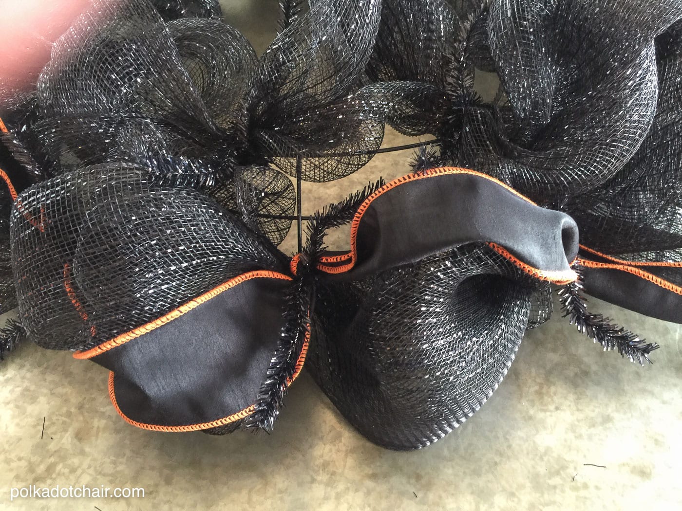 How to make a cute Halloween Eyeball wreath for your front door out of Geo Mesh and ribbon.