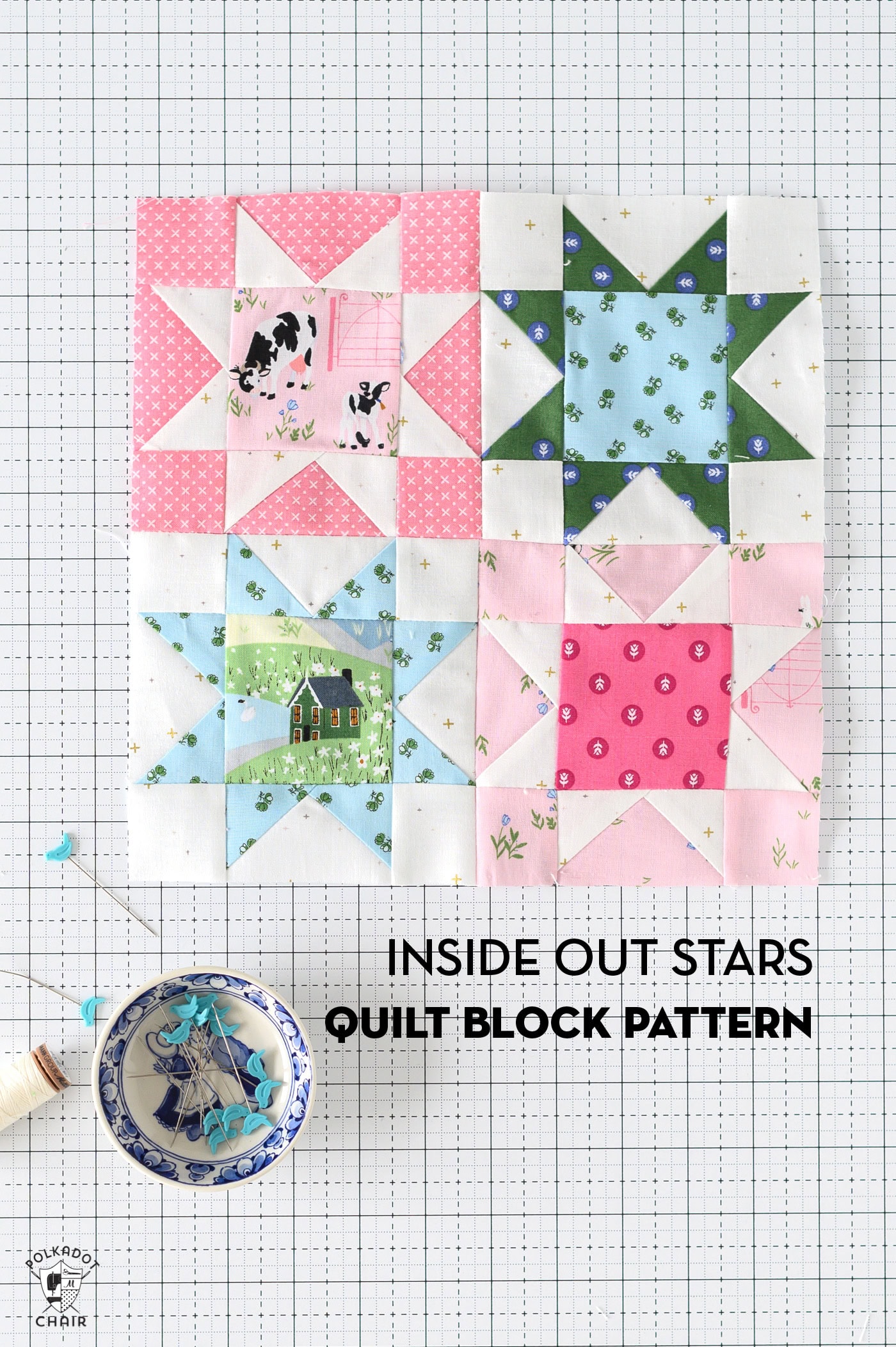 a pink, blue and green sawtooth star quilt block on white cutting mat with sewing notions