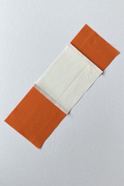 orange and cream fabric sew together