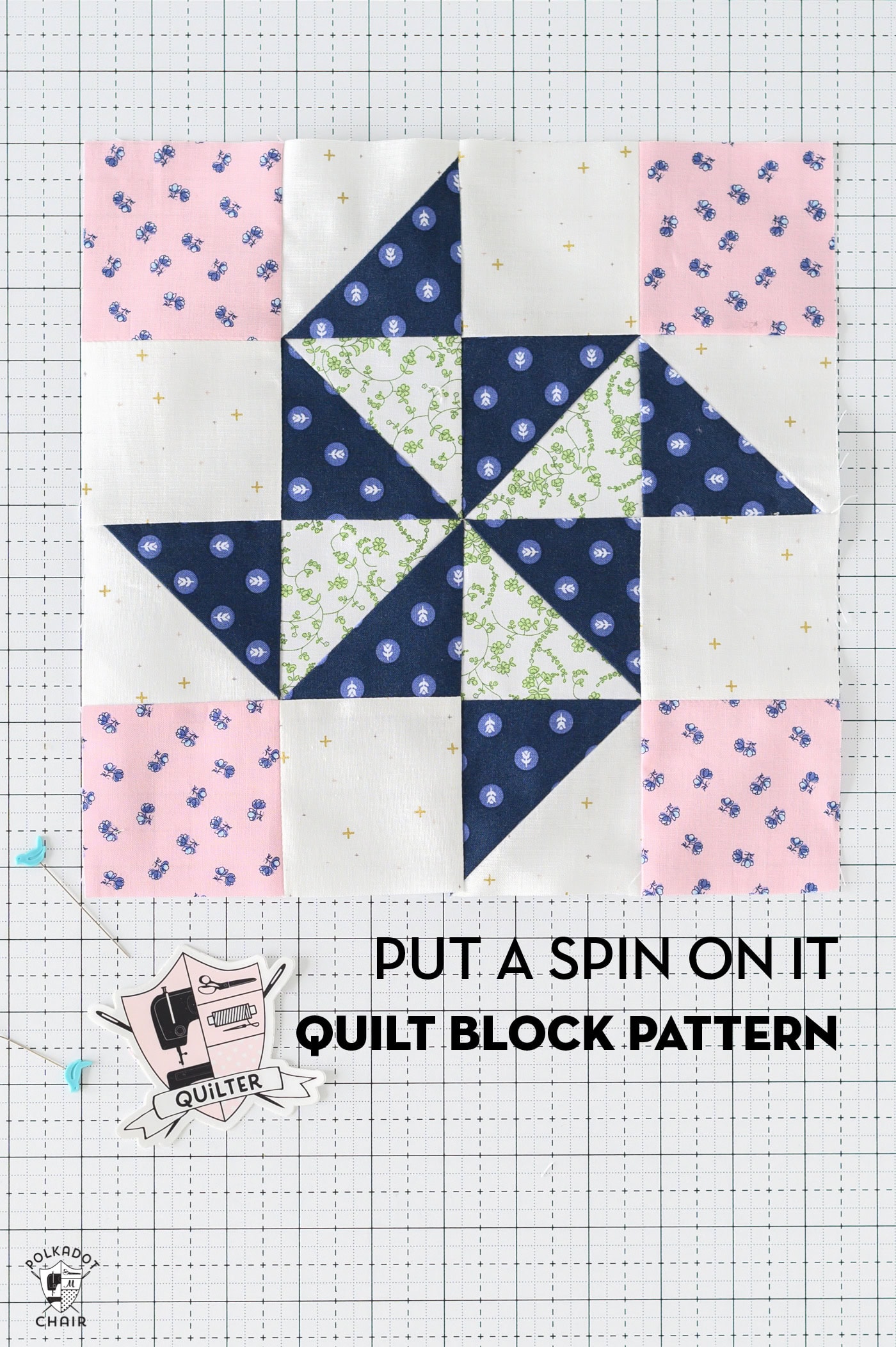 pink and blue quilt block on white cutting mat with sewing notions