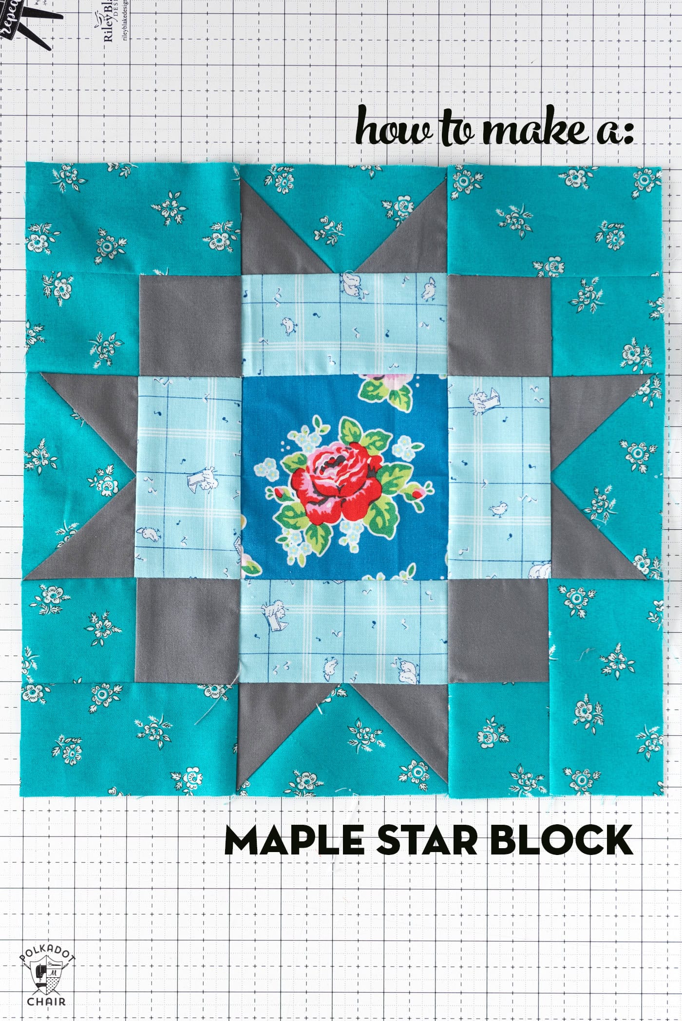 Aqua, blue and gray quilt block on white cutting mat