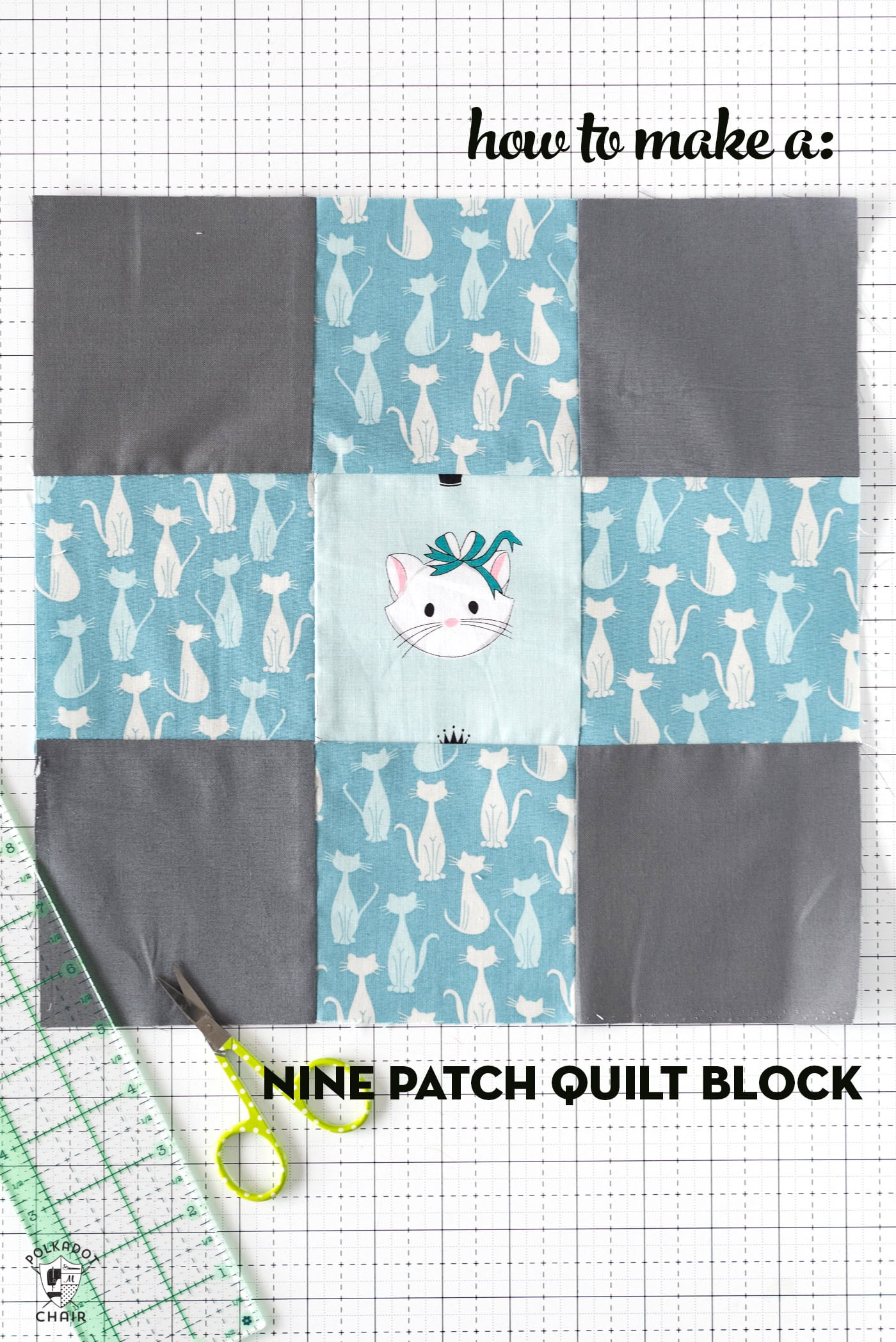 Blue and gray nine patch quilt block on white cutting mat with sewing notions